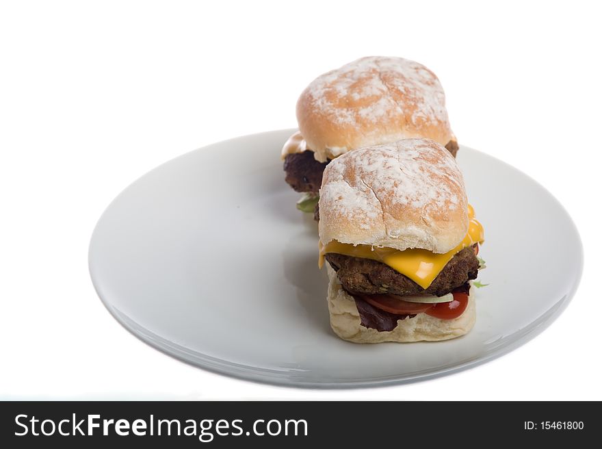 Home made burgers on a plate isolated on a white background