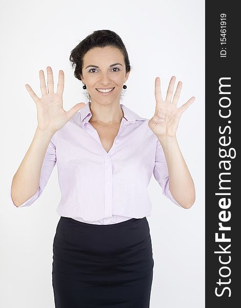 Young woman counting the number nine in front of a white background. Young woman counting the number nine in front of a white background