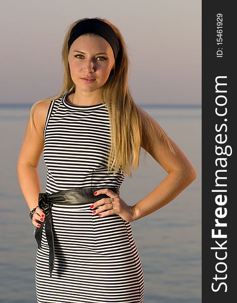 Pretty young girl posing at sea