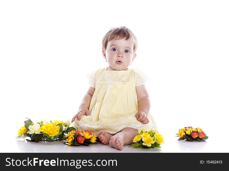 Portrait of lovely baby playing with flower on white background