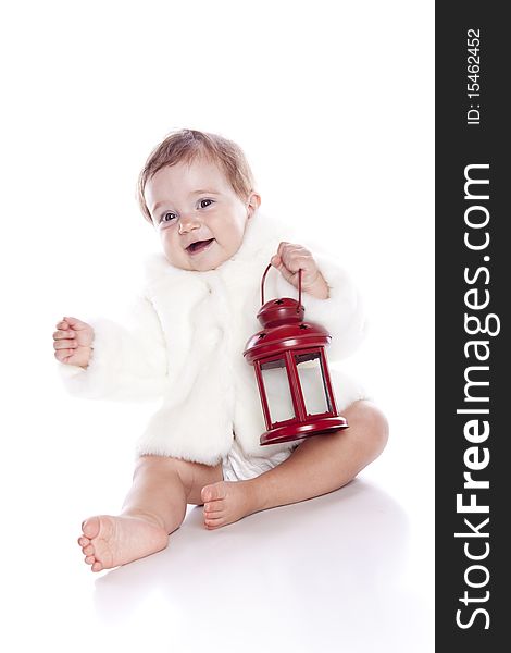 Cute little girl with a warm coat on white background