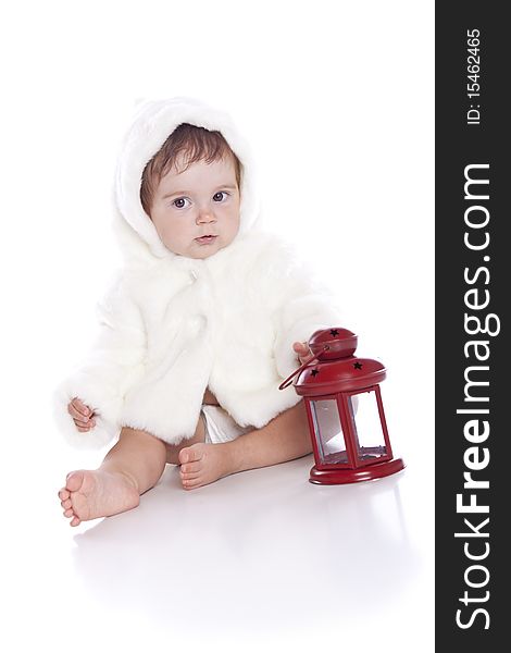 Cute little girl with a warm coat on white background