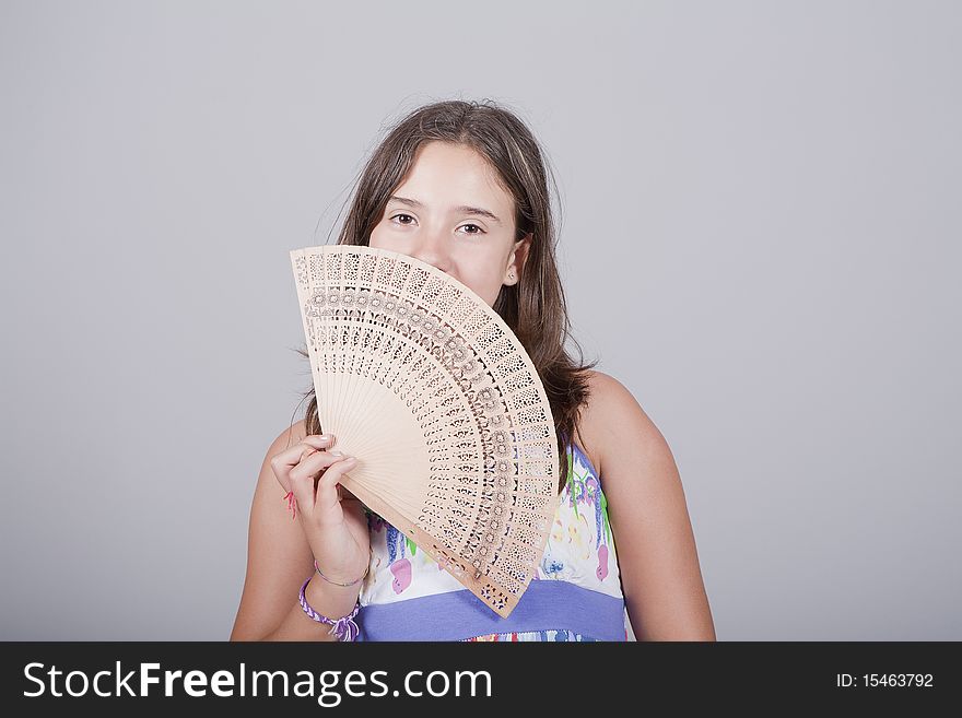 Girl with fan on her hand