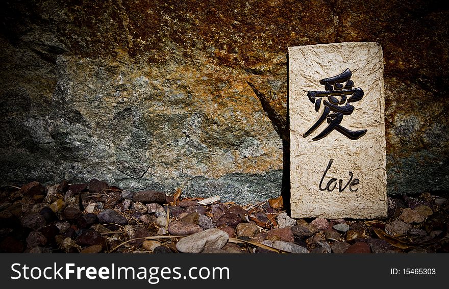 The word love written on a piece of rock. The word love written on a piece of rock