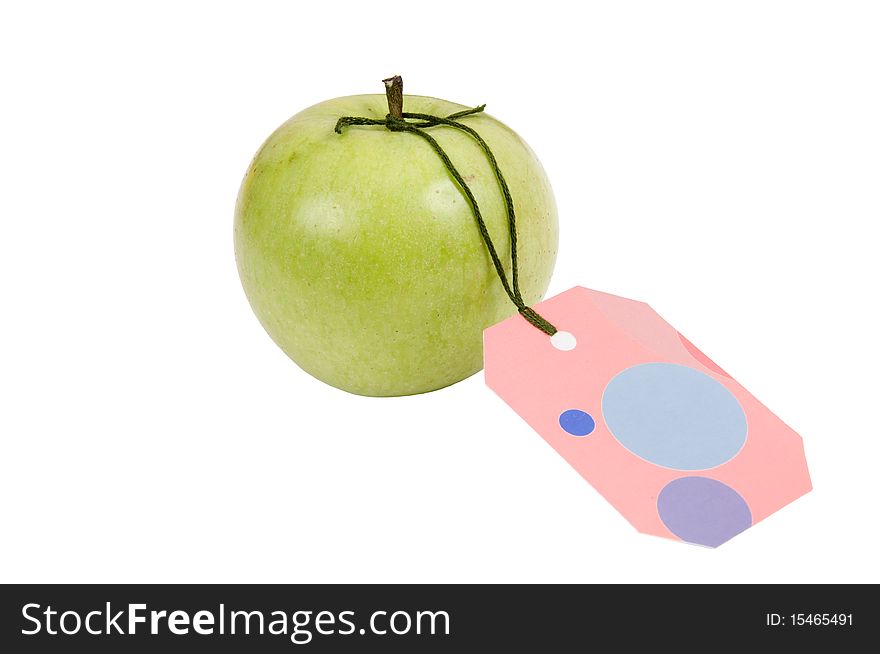 Green apple with a label on a white background. Green apple with a label on a white background