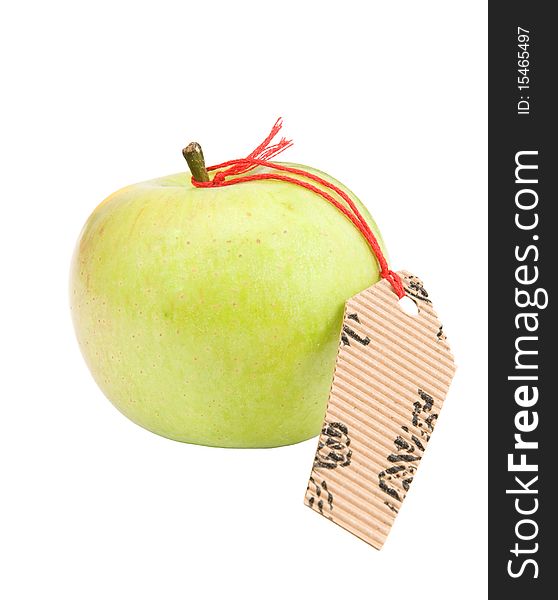 Green apple with a label on a white background. Green apple with a label on a white background