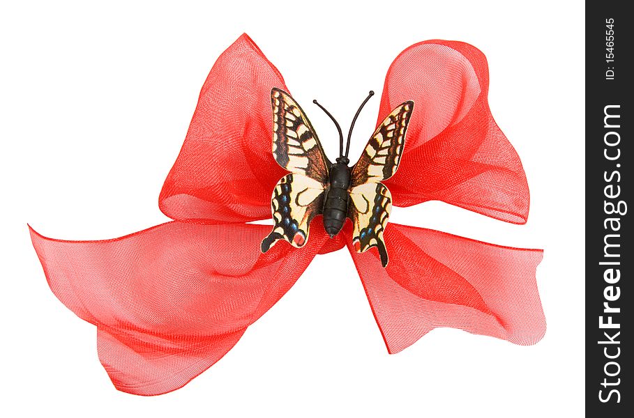 Red ribbon with a butterfly isolated on white background. Red ribbon with a butterfly isolated on white background