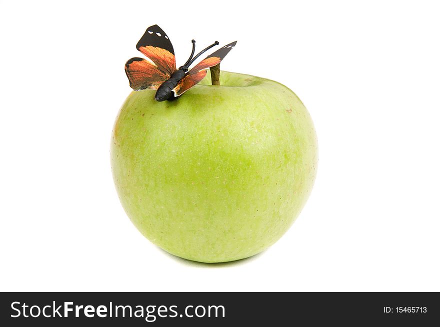 Butterfly and green apple on a white background. Butterfly and green apple on a white background