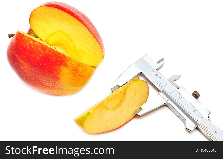 Slice of red apple is measured isolated on white background