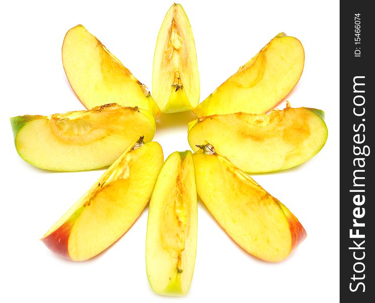 Slices of red and green apples on white background