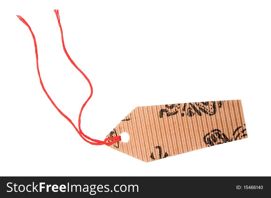 Tag is made of corrugated cardboard isolated on a white background. Tag is made of corrugated cardboard isolated on a white background