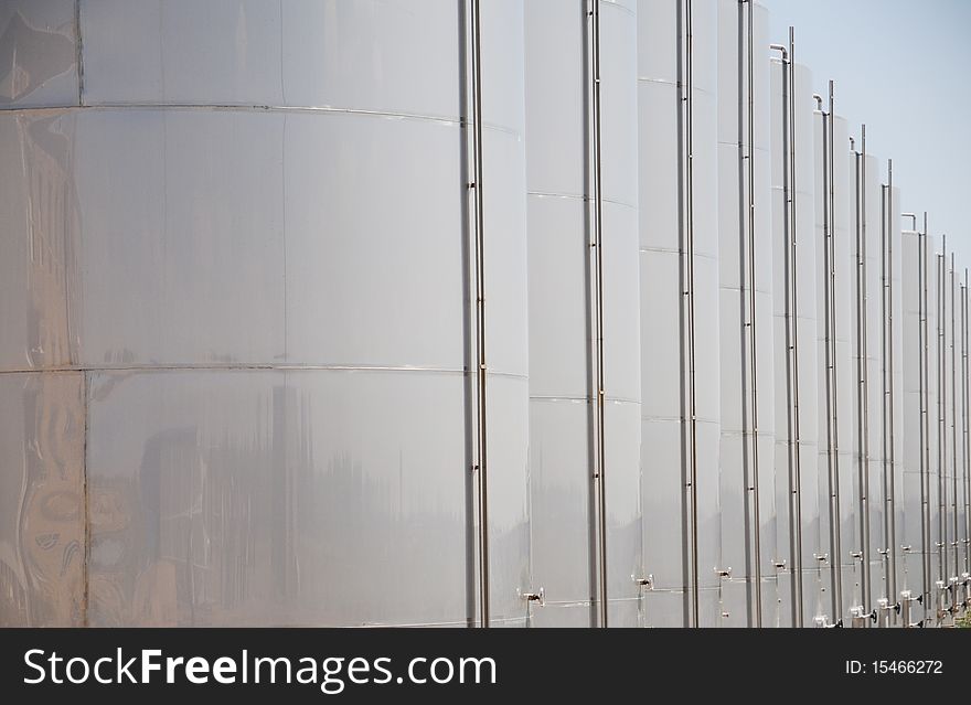 Row of fermentation cylinders in a fruit-and vegetable processing plant.