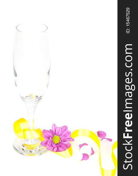 A champagne glass decorated and isolated on a white table