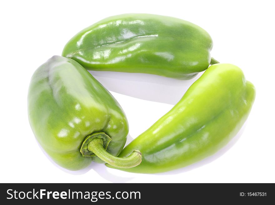 Three Green Peppers On White
