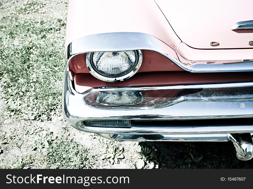 Close up of the headlight of an american classic car