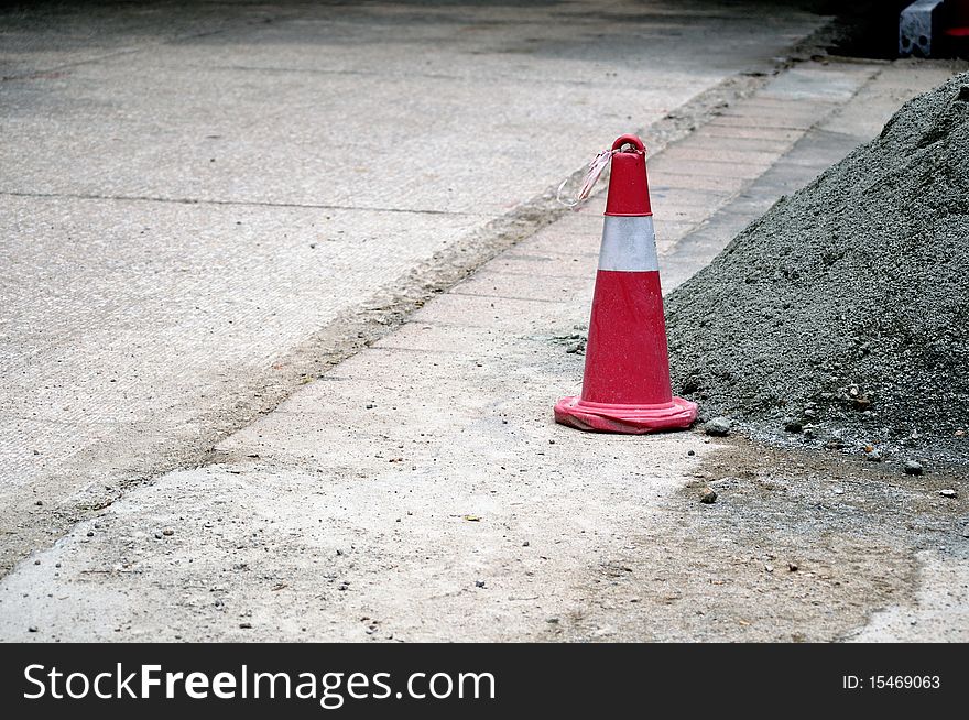 red sagety cones on a building road. red sagety cones on a building road