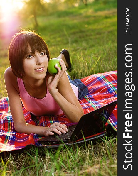 Lovely Girl With Laptop In The Park