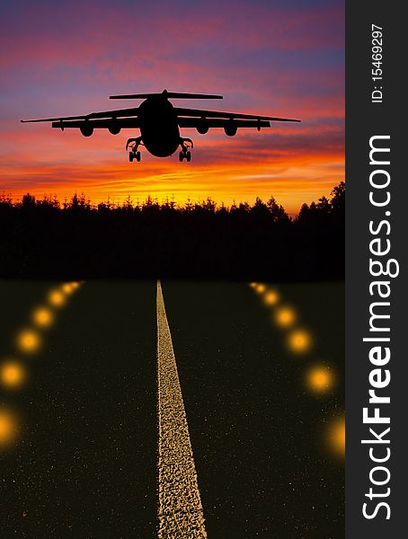 Airplane silhouette landing on runway in sunset