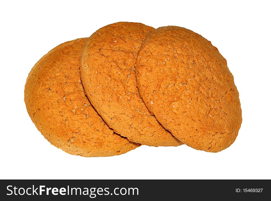 Three ruddy oat cookies isolated on white background.