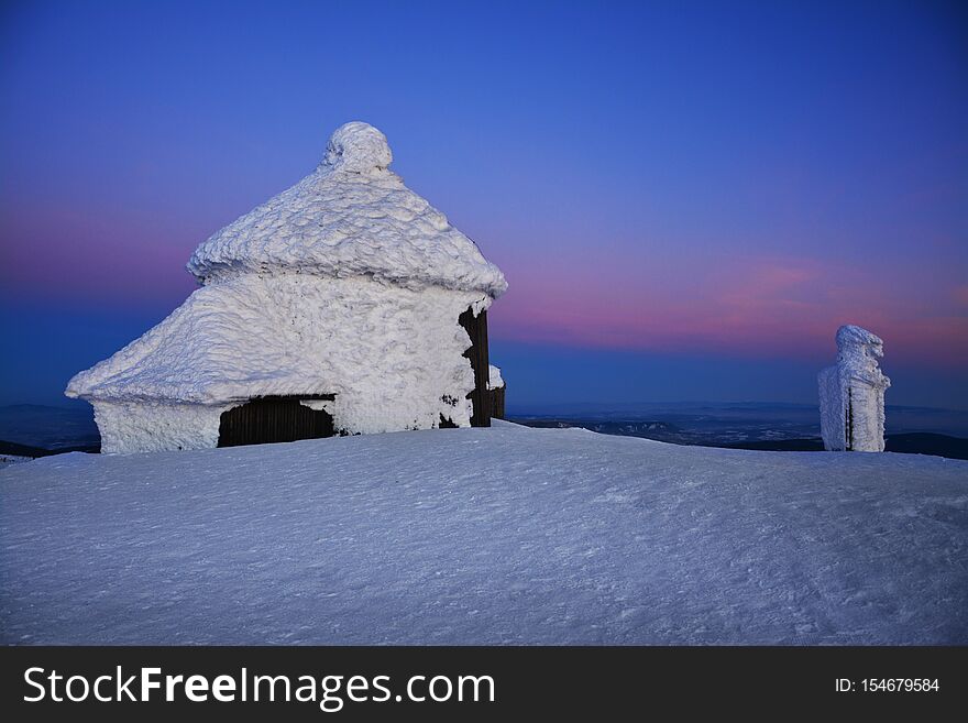 Winter sunset over the Sniezka mount in the Giant Mountains, Karkonosze, Poland