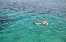 Man Floating In The Sea. Stock Photo Man Floating In The Sea. Stock Photo