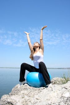 Young Woman Stretching To The Sun Stock Image