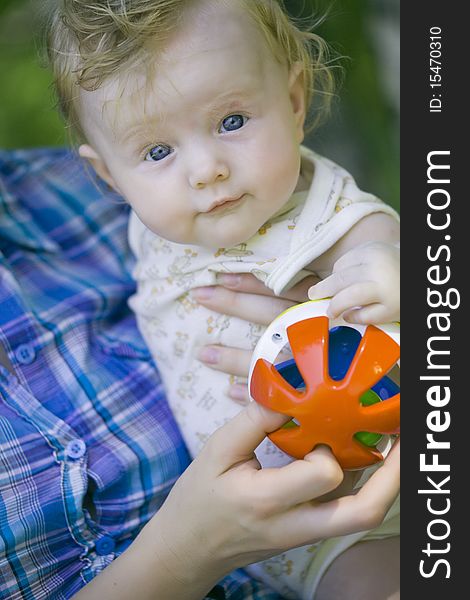 Mother with happy baby on the hands - outdoors. Mother with happy baby on the hands - outdoors