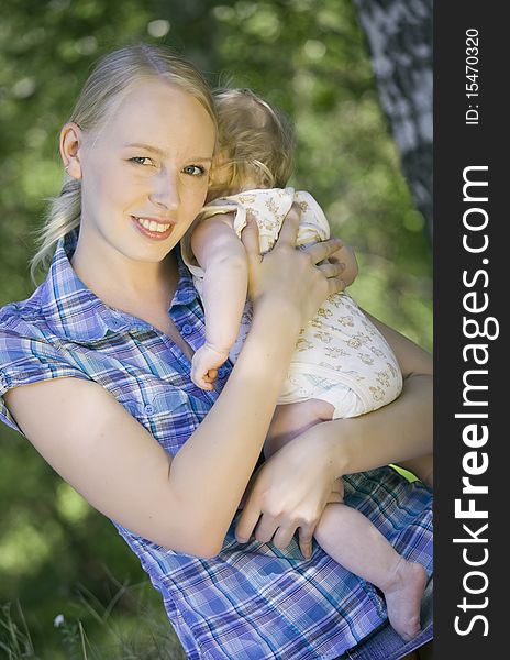 Portrait of happy mother with her baby on the hands. Portrait of happy mother with her baby on the hands