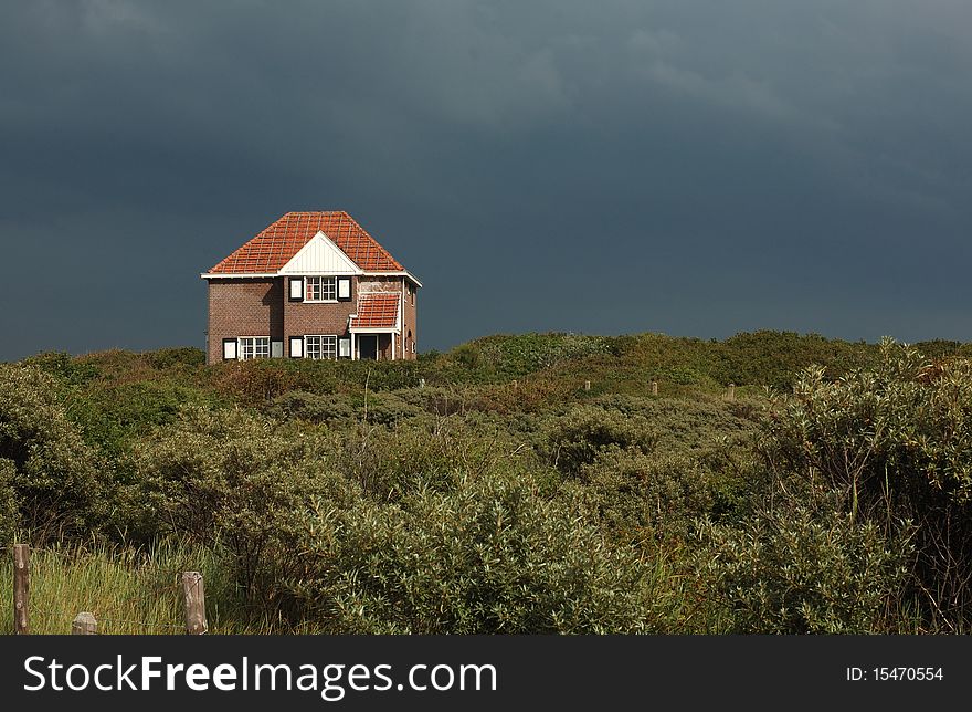 Typical dutch house on sand dune. Typical dutch house on sand dune