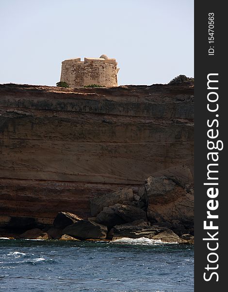 Stony medieval watch tower on the cliff