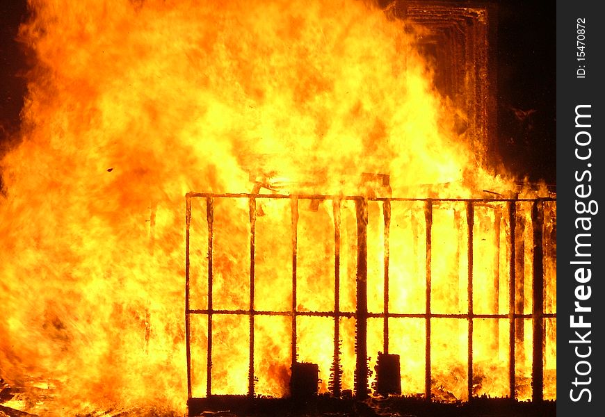 Flames burning wooden pallets at a bonfire night celebration. Flames burning wooden pallets at a bonfire night celebration