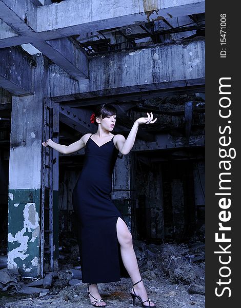 Beautiful caucasian young woman performing contemporary dance in devastated building. Beautiful caucasian young woman performing contemporary dance in devastated building