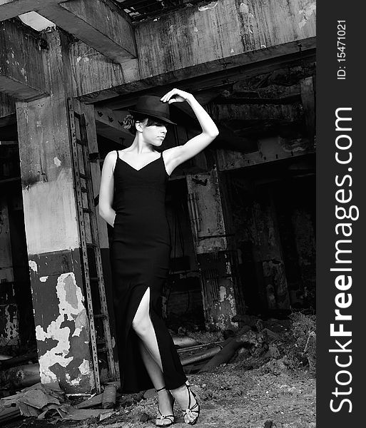 Black and white photo with beautiful caucasian young woman performing contemporary dance in devastated building. Black and white photo with beautiful caucasian young woman performing contemporary dance in devastated building