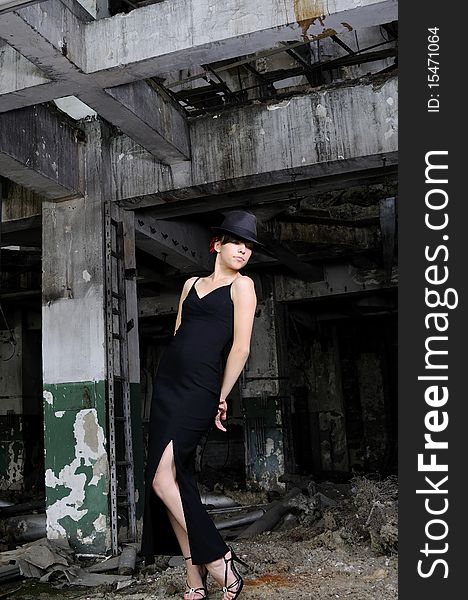 White young artist woman performing in devastated building. White young artist woman performing in devastated building