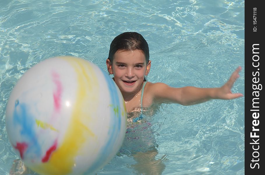 Girl Playing Ball In Pool