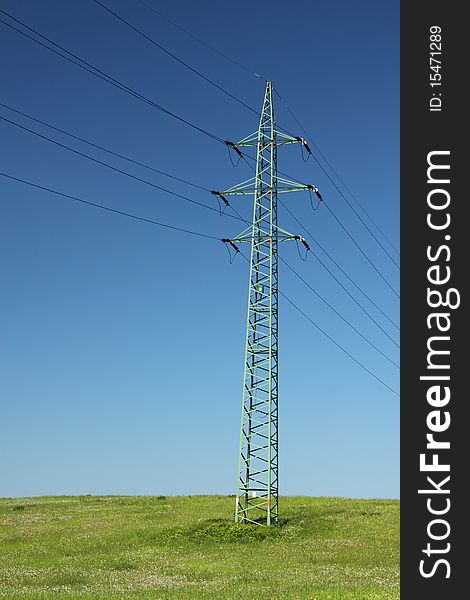 Single electric line pole on the grass field. Single electric line pole on the grass field