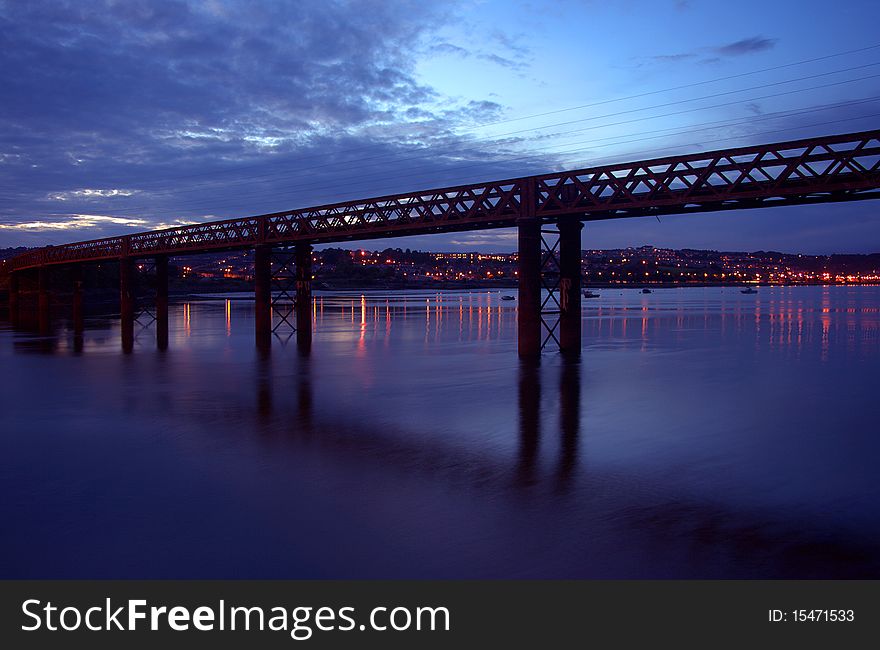 A old railway bridge passing over the sea in Devon. A old railway bridge passing over the sea in Devon