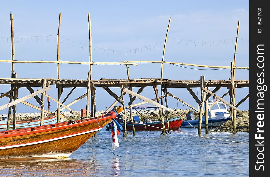 Traditional Thai long tail boats in a quiet bay