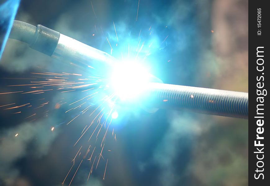 Sparks a smoke and flashes in the course of metal welding. Sparks a smoke and flashes in the course of metal welding