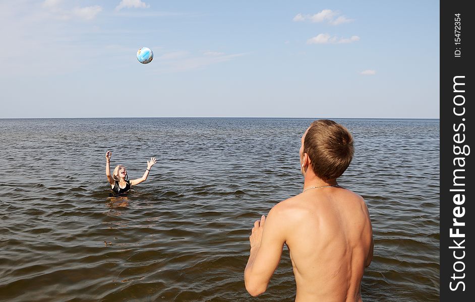 Girl and boy playing in the water. Girl and boy playing in the water.