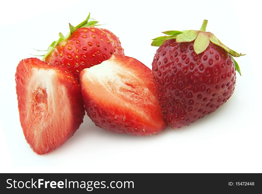 Ripe strawberry lobes on a white background