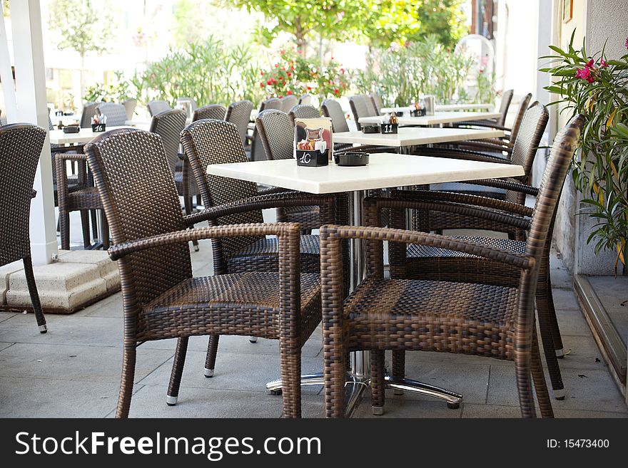 Restaurant tables with wicker chairs