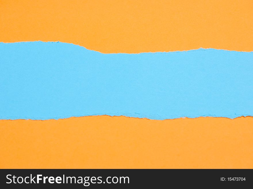 Ripped blue Paper on yellow background. Ripped blue Paper on yellow background