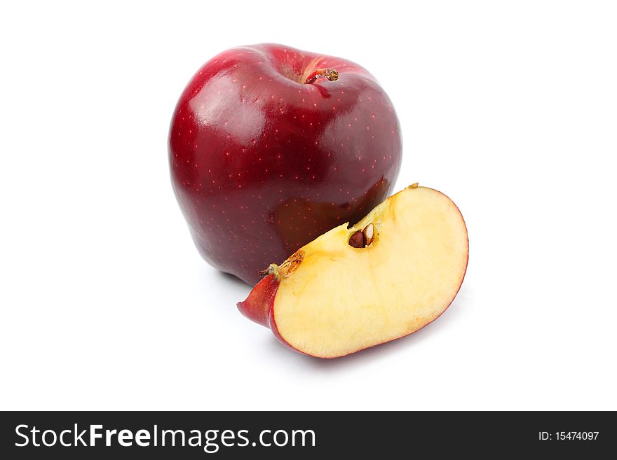 Close up of red apple with pieces isolated on white background.