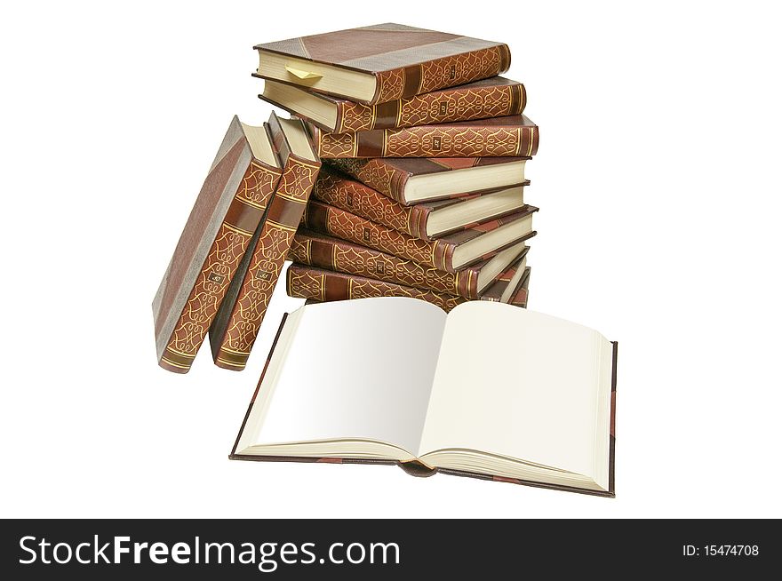 This image shows a collection of old books, stacked with open, showing a blank page. This image shows a collection of old books, stacked with open, showing a blank page