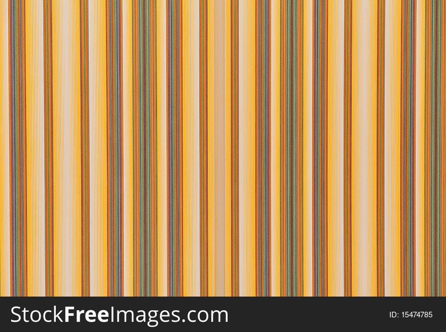 The image shows a background or a texture composed of a fabric of various colors arranged in bands. The image shows a background or a texture composed of a fabric of various colors arranged in bands.