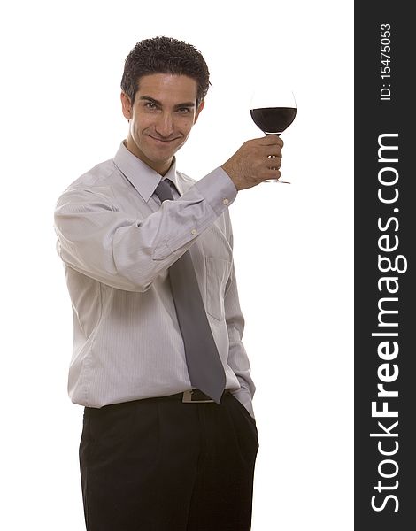 Businessman celebrating his success with a glass of red wine