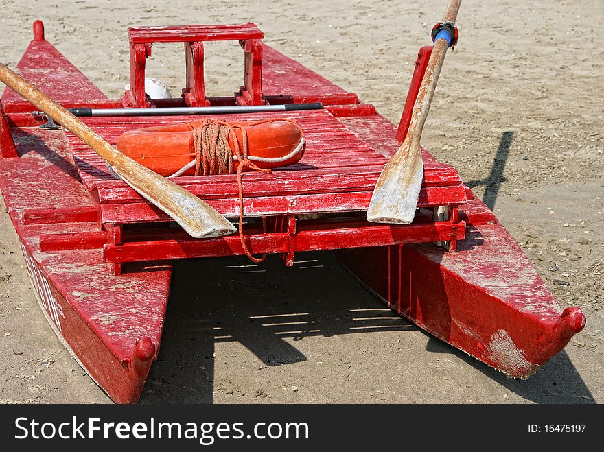 Red pedalo used by lifeguards on a beach. Red pedalo used by lifeguards on a beach