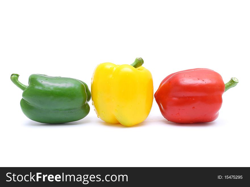 Close up of red, yellow and green pepper isolated on white background. Close up of red, yellow and green pepper isolated on white background.