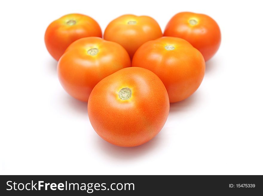 Close up of six tomatoes isolated on white background.